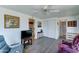Comfortable living room with ceiling fan, nice vinyl floors, and multiple doors at 111 S Greenfield Rd # 531, Mesa, AZ 85206