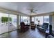 Comfortable living room with sliding glass doors to the patio allowing natural light to flood the space at 111 S Greenfield Rd # 531, Mesa, AZ 85206