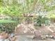 Tranquil backyard setting with lush landscaping and decorative garden accents at 1118 E Orangewood Ave, Phoenix, AZ 85020