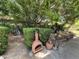 A covered patio overlooks a manicured backyard space with garden and mature trees at 1118 E Orangewood Ave, Phoenix, AZ 85020