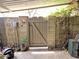 Backyard gate provides access and decorative elements like a hummingbird and cactus at 1118 E Orangewood Ave, Phoenix, AZ 85020