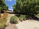 Backyard with mature landscaping, hardscape, and garden providing a private and serene outdoor space at 1118 E Orangewood Ave, Phoenix, AZ 85020