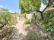 Secluded backyard patio features outdoor dining, mature landscaping, and a calming water feature at 1118 E Orangewood Ave, Phoenix, AZ 85020