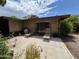 Backyard patio with lounge chairs, offering a private and relaxing outdoor space at 1118 E Orangewood Ave, Phoenix, AZ 85020