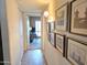 Hallway featuring tile floors and picture frames showcases space and character at 1118 E Orangewood Ave, Phoenix, AZ 85020