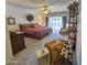 Large main bedroom offering ample space, outside access, and a comfortable seating area at 1118 E Orangewood Ave, Phoenix, AZ 85020