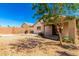 Backyard with gravel landscaping and brick privacy wall at 11182 W Coronado Rd, Avondale, AZ 85392