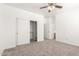 A well-lit bedroom showcasing a sliding door closet and carpet, offering ample storage and comfort at 11182 W Coronado Rd, Avondale, AZ 85392