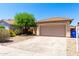 Charming single-story home featuring desert landscaping and a two-car garage at 11182 W Coronado Rd, Avondale, AZ 85392