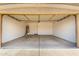 Spacious two car garage with painted walls and concrete flooring at 11182 W Coronado Rd, Avondale, AZ 85392