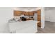 Well-equipped kitchen with granite countertops and bright white lighting and modern appliances at 11182 W Coronado Rd, Avondale, AZ 85392