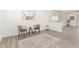 A modern living room is decorated with neutral tones, wooden flooring, and contemporary art at 11182 W Coronado Rd, Avondale, AZ 85392