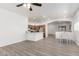 Open-concept living space with a view of the kitchen, dining area, and sleek, modern floors at 11182 W Coronado Rd, Avondale, AZ 85392