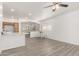 Open-concept living space flowing into a dining area and modern kitchen at 11182 W Coronado Rd, Avondale, AZ 85392