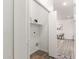 Open storage area in hallway with shelving and hookups for appliances at 11182 W Coronado Rd, Avondale, AZ 85392