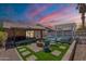 Inviting backyard featuring a cozy fire pit, pool, and a covered patio, ideal for outdoor living and entertaining at 11252 E Edgewood Ave, Mesa, AZ 85208