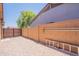 Large backyard with a high brick fence and a gate, perfect for outdoor activities and secure privacy at 11252 E Edgewood Ave, Mesa, AZ 85208