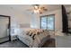 Charming bedroom with carpet flooring, a ceiling fan, and bright natural light at 11252 E Edgewood Ave, Mesa, AZ 85208