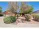 Beautiful home featuring lush landscaping, mature trees, a stone walkway and a two car garage at 11252 E Edgewood Ave, Mesa, AZ 85208