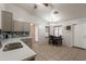 Modern kitchen features quartz countertops and stainless steel appliances plus an eat in dining area at 11252 E Edgewood Ave, Mesa, AZ 85208
