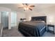 Comfortable bedroom with a ceiling fan, workstation, and a neutral color palette at 11252 E Edgewood Ave, Mesa, AZ 85208