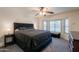 Spacious main bedroom featuring a tray ceiling fan and a bay window with shutters at 11252 E Edgewood Ave, Mesa, AZ 85208