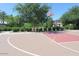 Community basketball court with lush green trees and landscaping at 1134 S Lydia Ln, Gilbert, AZ 85296