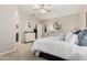 Spacious bedroom with neutral tones, walk-in closet, ensuite bathroom, and access to other living spaces at 1134 S Lydia Ln, Gilbert, AZ 85296