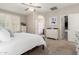 Bedroom with light walls, carpet, ceiling fan, walk-in closet, and plenty of natural light at 1134 S Lydia Ln, Gilbert, AZ 85296