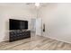 Bedroom with wood-look floors and view to open doorway and stairwell at 1134 S Lydia Ln, Gilbert, AZ 85296
