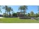 Stone community entrance with lush green grass at 1134 S Lydia Ln, Gilbert, AZ 85296