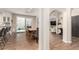 Bright dining area with access to the backyard, wood floors, and comfortable seating at 1134 S Lydia Ln, Gilbert, AZ 85296