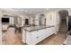 Modern kitchen island and dining area with arched doorway at 1134 S Lydia Ln, Gilbert, AZ 85296
