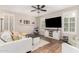 Cozy living room with large TV, shutters, and stylish decor at 1134 S Lydia Ln, Gilbert, AZ 85296