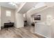 Open loft area featuring hardwood flooring, a keyboard, a desk, and stylish decor at 1134 S Lydia Ln, Gilbert, AZ 85296