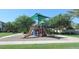 Community playground featuring slides, climbing structure and sun shades in a well-maintained park-like setting at 1134 S Lydia Ln, Gilbert, AZ 85296
