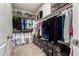 Walk-in closet with organized hanging rods, shelving, and storage solutions for clothing and shoes at 1134 S Lydia Ln, Gilbert, AZ 85296