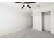 Well-lit bedroom with carpet and a closet with sliding doors at 12531 W Glenn Dr, Glendale, AZ 85307