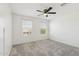Bright bedroom with neutral carpet and two windows offering natural light at 12531 W Glenn Dr, Glendale, AZ 85307