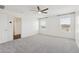 Large bedroom with carpet, windows for natural light, and an ensuite bathroom at 12531 W Glenn Dr, Glendale, AZ 85307