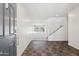 Bright foyer boasts dark flooring and leads into a living space with a staircase visible at 12531 W Glenn Dr, Glendale, AZ 85307