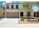 Charming two-story home featuring a front yard, a two-car garage and a welcoming entrance at 12531 W Glenn Dr, Glendale, AZ 85307