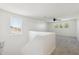 Bright upstairs landing with large window and neutral carpet, perfect for a quiet seating area at 12531 W Glenn Dr, Glendale, AZ 85307