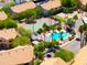 Aerial view of resort-style amenities including a refreshing community pool and tennis court surrounded by lush landscaping at 1287 N Alma School Rd # 171, Chandler, AZ 85224