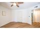 Cozy bedroom with ceiling fan and entry into adjoining bathroom and closet at 1287 N Alma School Rd # 171, Chandler, AZ 85224