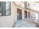 Inviting condo exterior with neutral stucco, covered walkways, and convenient access to upper level units via stairs at 1287 N Alma School Rd # 171, Chandler, AZ 85224