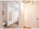Hallway leading to bathroom with shower, vanity, and door to additional space at 1287 N Alma School Rd # 171, Chandler, AZ 85224
