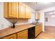 Kitchen area featuring wood cabinets and neutral countertops at 1287 N Alma School Rd # 171, Chandler, AZ 85224