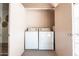 Enclosed laundry area featuring a washer and dryer for added convenience at 1287 N Alma School Rd # 171, Chandler, AZ 85224