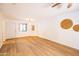 Bright living room featuring wood floors and white walls at 1287 N Alma School Rd # 171, Chandler, AZ 85224